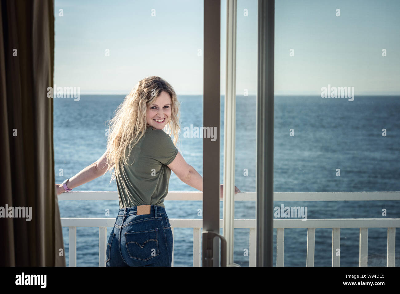 Slim blonde female rear view hi-res stock photography and images - Alamy