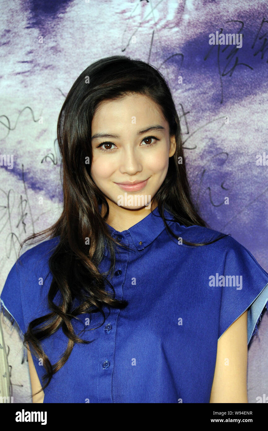 Hong Kong actress Angelababy smiles during a premiere for her movie, Crimes of Passion, in Beijing, China, 6 August 2013. Stock Photo