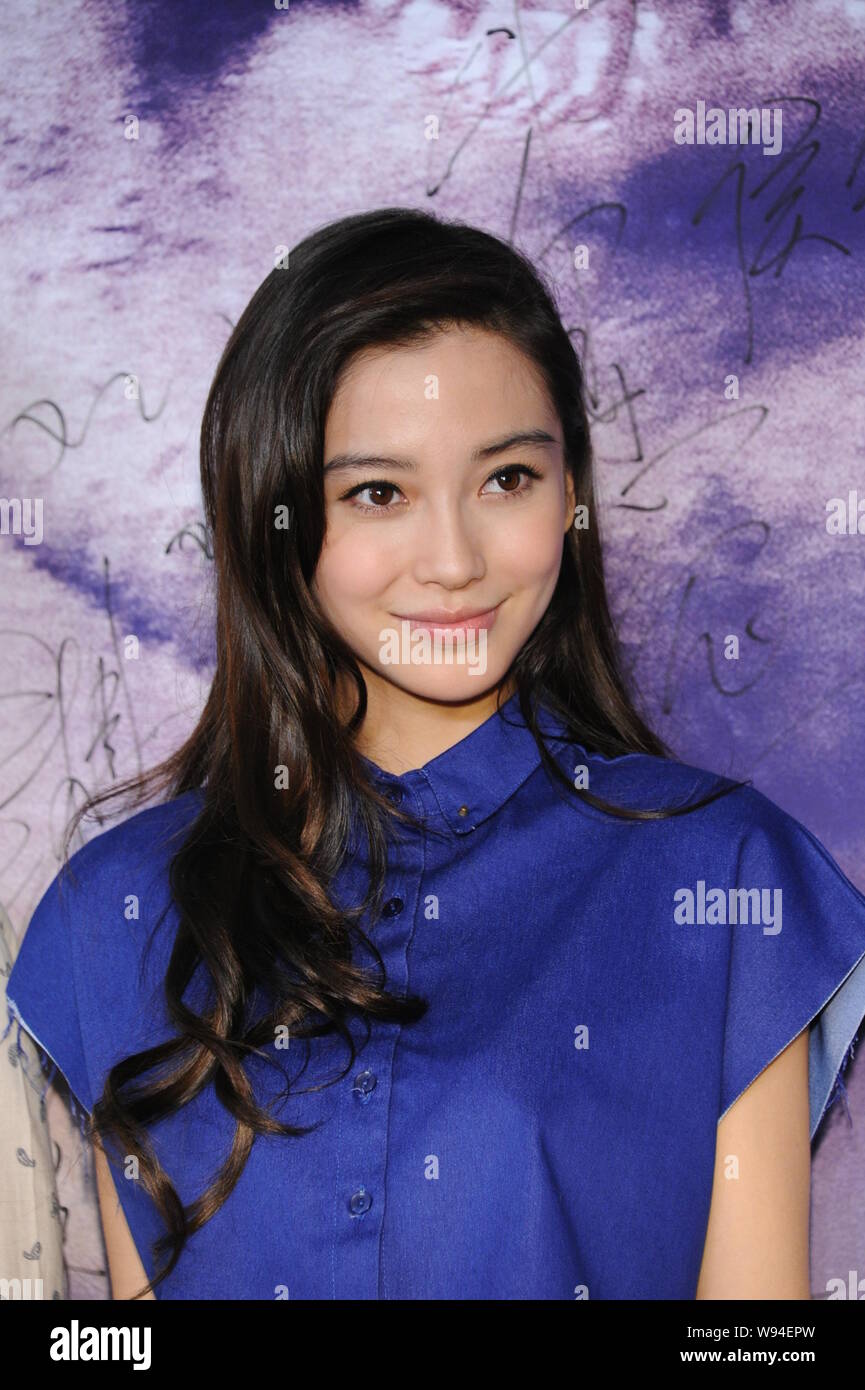 Hong Kong actress Angelababy smiles during a premiere for her movie, Crimes of Passion, in Beijing, China, 6 August 2013. Stock Photo