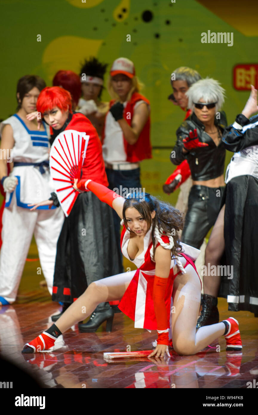 Chinese contestants dressed in the costumes of the figures in the electronic video game KOF (The King Of Fighters) perform in the final of the 10th Su Stock Photo