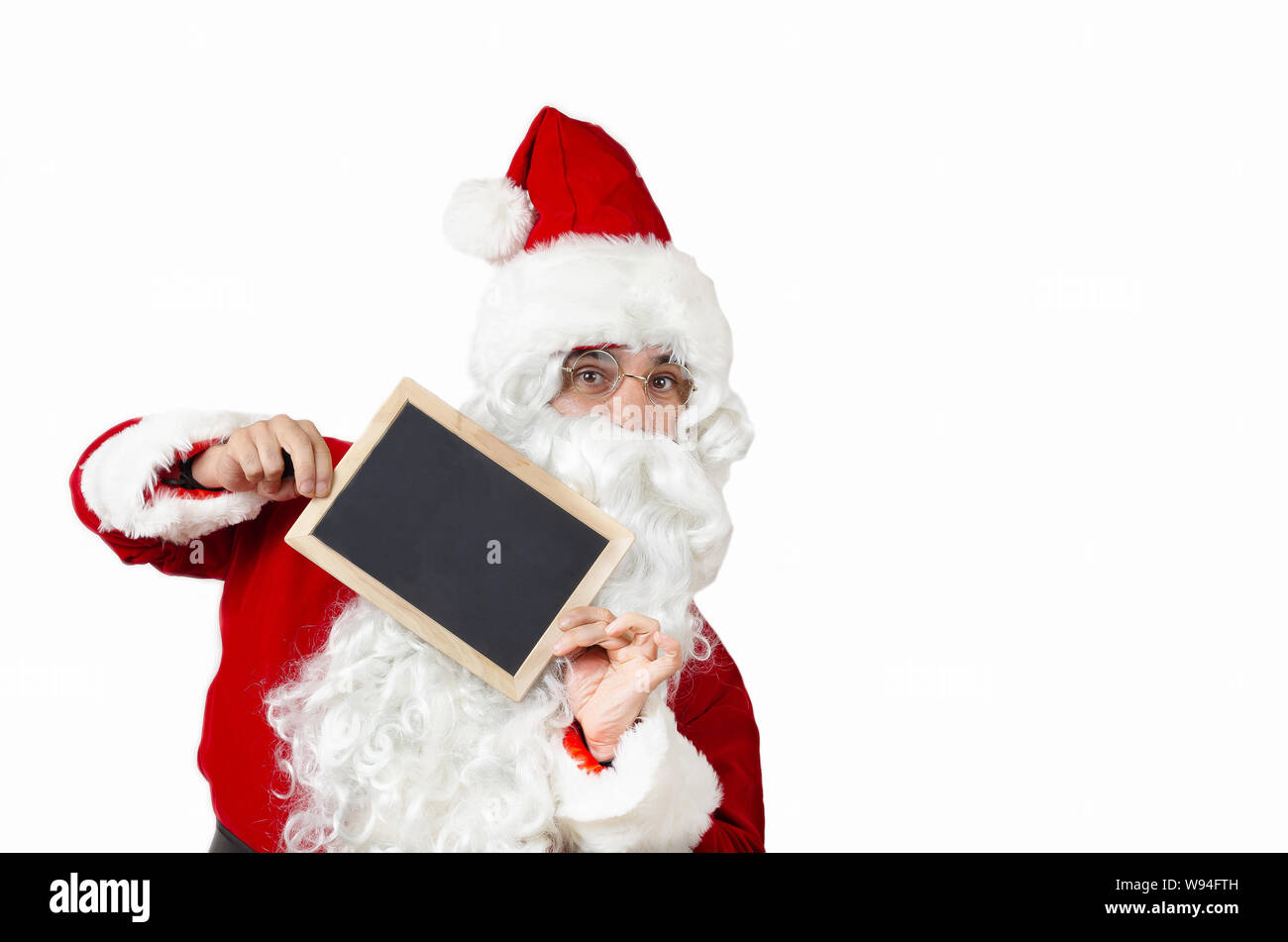Santa Claus with a blackboard and copy space Stock Photo - Alamy
