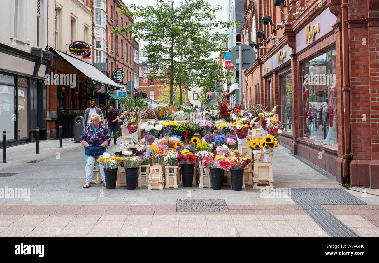Flower seller on Grafton Street, Dublin city, Ireland. Stock Photo