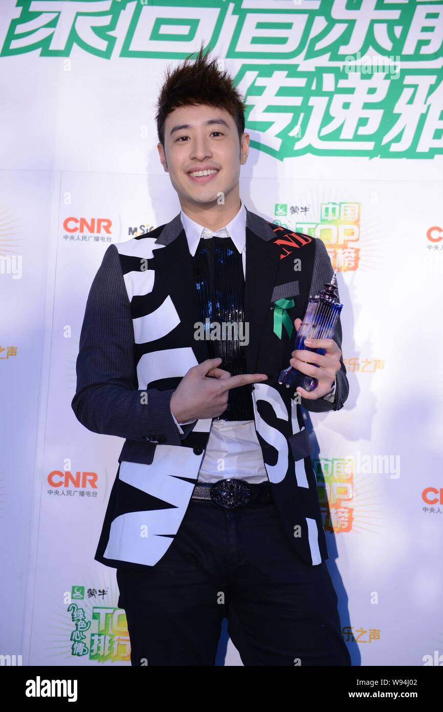 Taiwanese singer Wilber Pan poses with his trophy of Best Male Singer from Hong Kong and Taiwan at the backstage of the Music Radio China Top Chart Aw Stock Photo