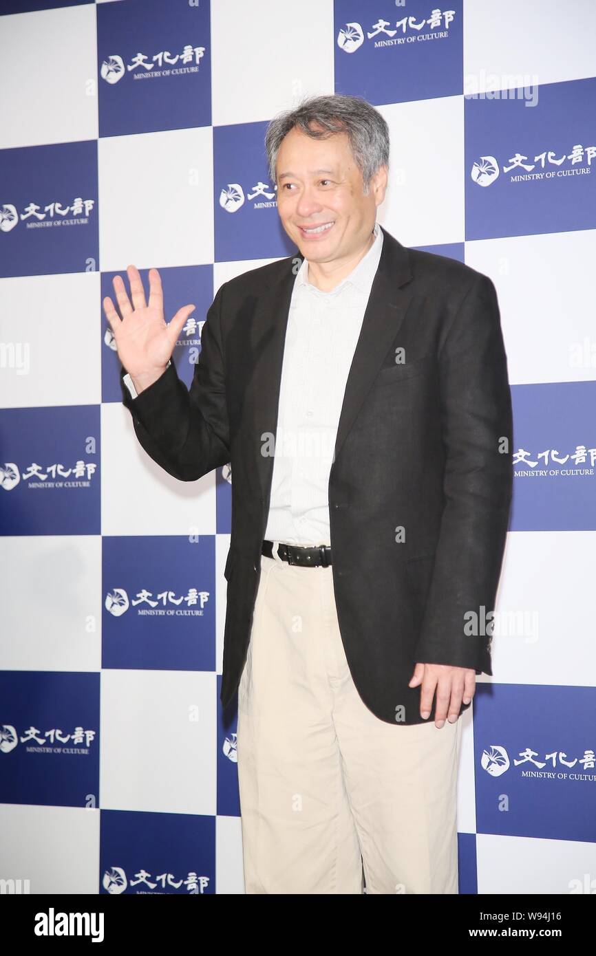 Taiwanese director Ang Lee waves during a press conference in Taipei, Taiwan, 9 May 2013. Stock Photo