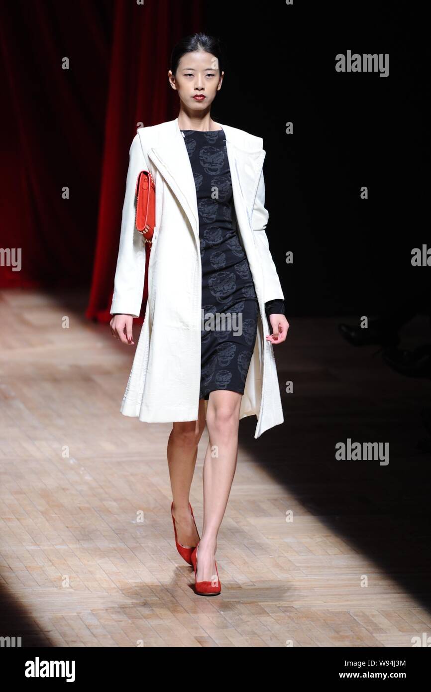 A model displays a new creation by Chinese fashion designer Wang Yutao ...