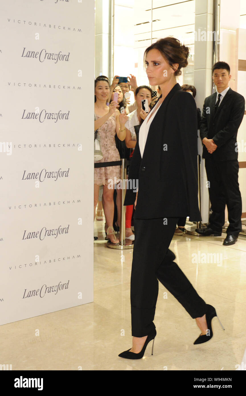 English singer and socialite Victoria Beckham, wife of David Beckham, arrives at the launch ceremony of the 2013 autumn/winter collection of her own f Stock Photo