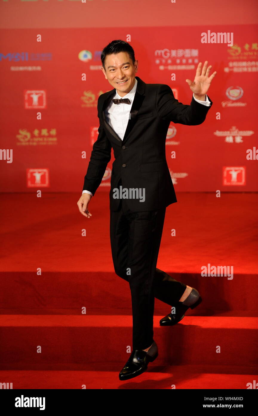 Andy Yu Hong Kong actor Andy Lau waves on the red carpet as he arrives for the ...