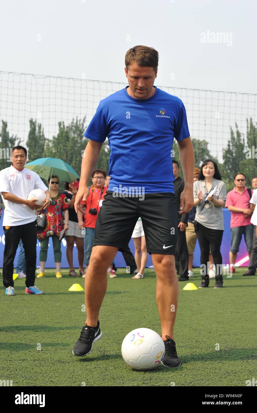 English soccer star Michael Owen shows his football skills at a promotional event of European sports stadium business operator SoccerWorld during his Stock Photo