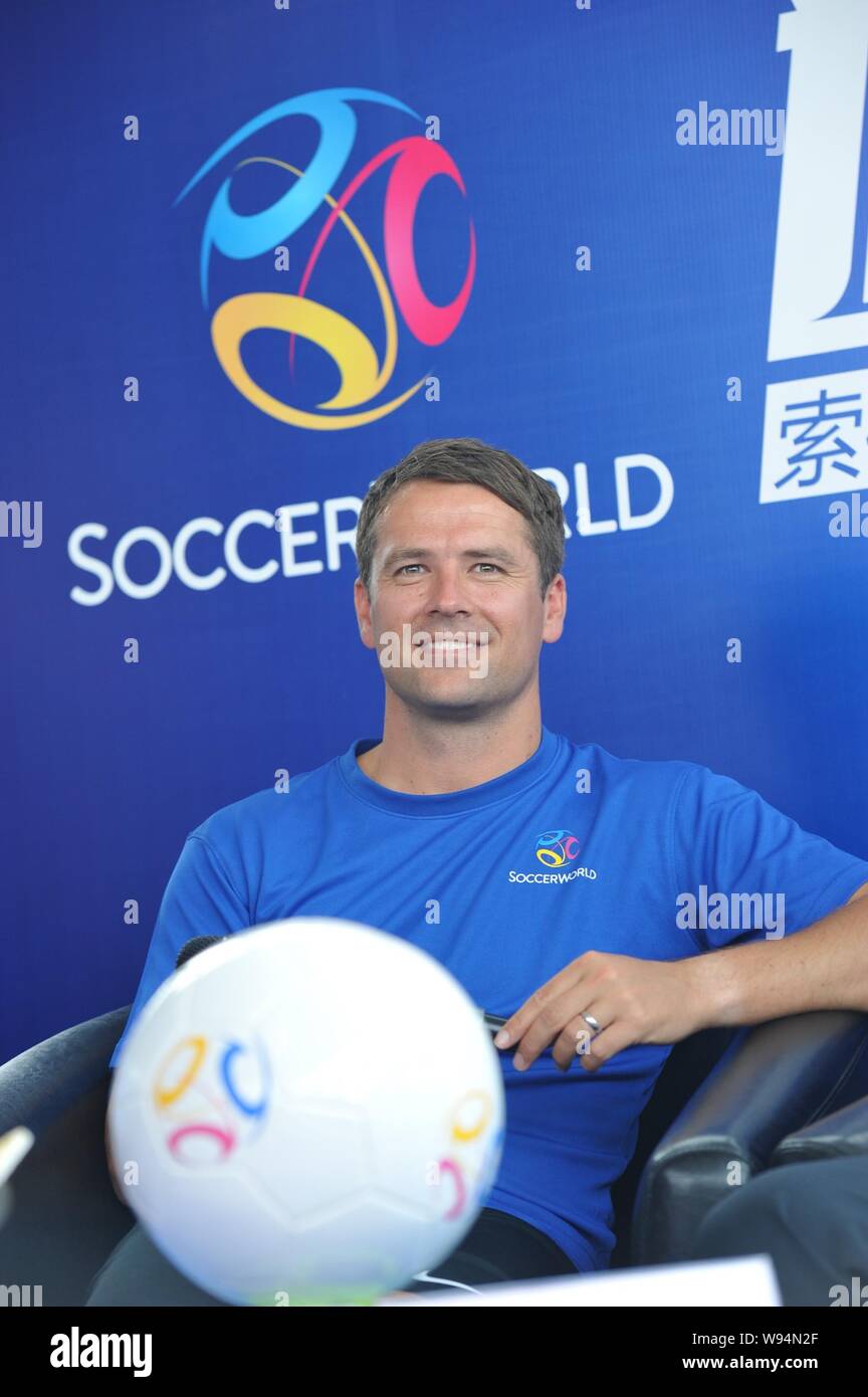 English soccer star Michael Owen smiles at a promotional event of European sports stadium business operator SoccerWorld during his China tour in Beiji Stock Photo
