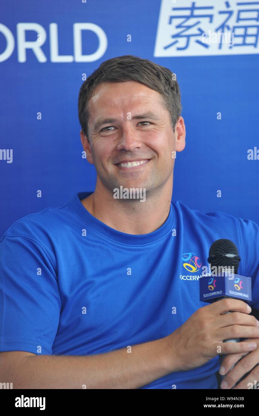 English soccer star Michael Owen smiles at a promotional event of
