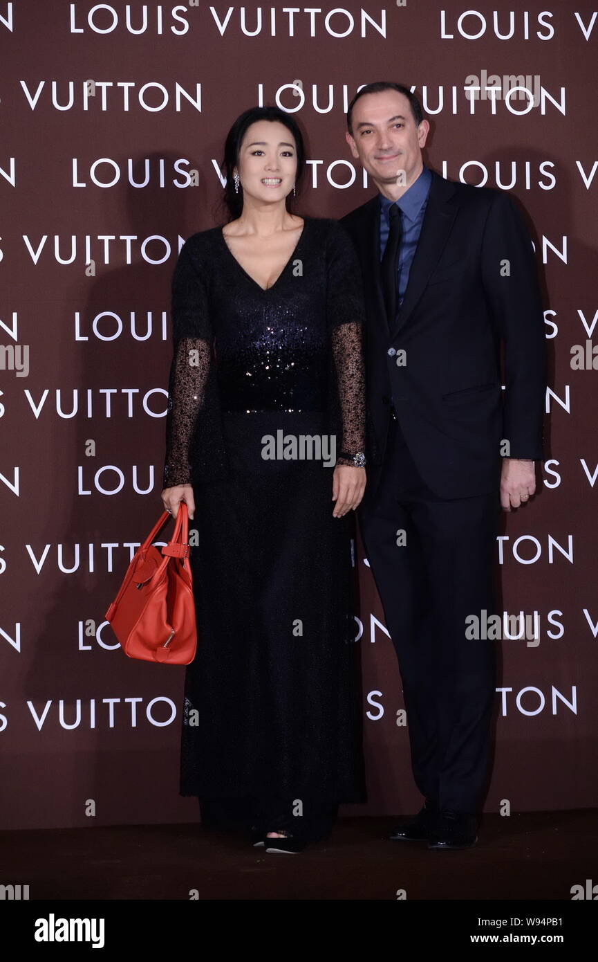 Chinese actress Gong Li, left, poses with Philippe Fortunato