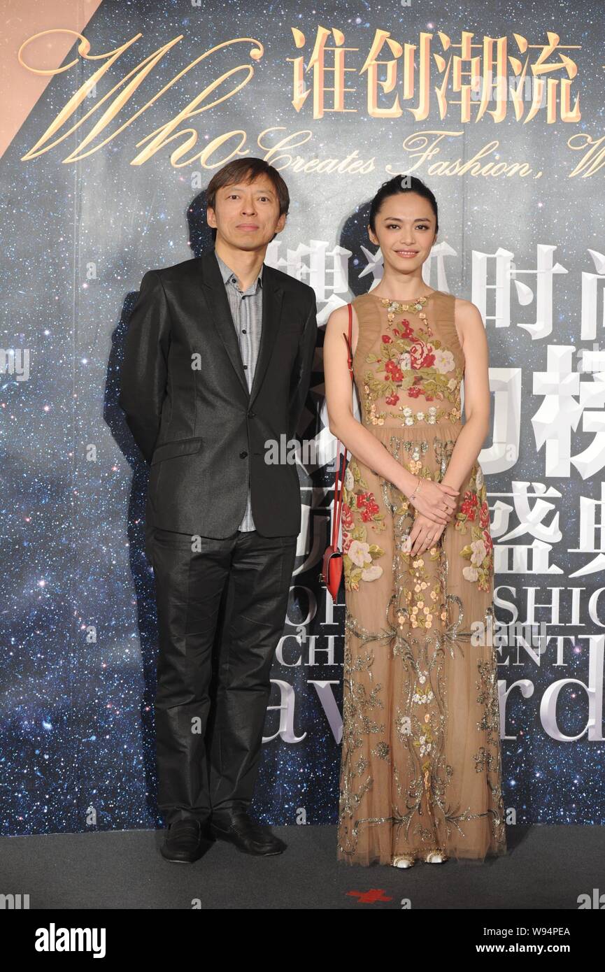 Charles Zhang Chaoyang (left), CEO of Sohu.com Inc. and Chinese actress Yao Chen pose as they arrive for the 2012 Sohu Fashion Achievement Awards cere Stock Photo