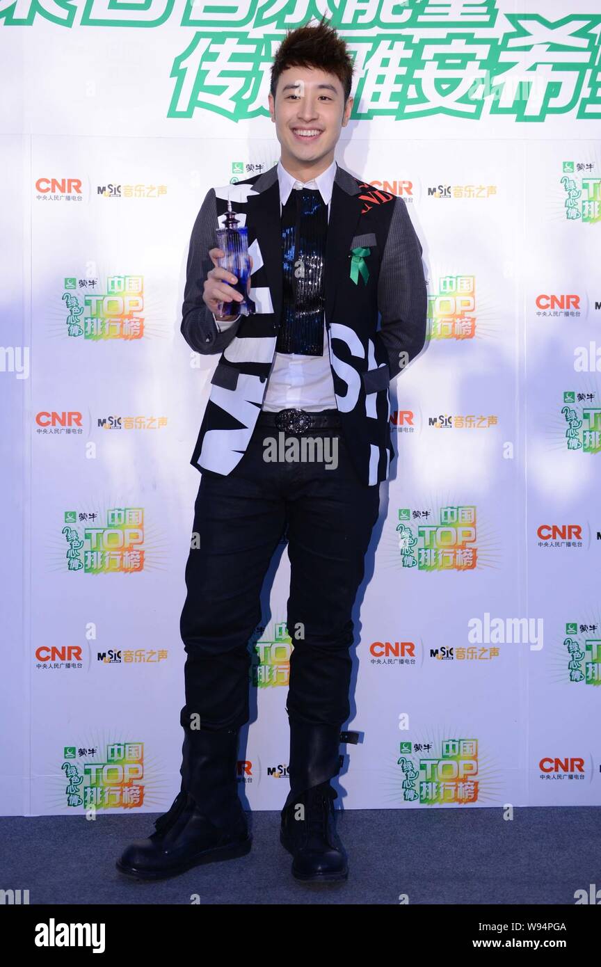 Taiwanese singer Wilber Pan poses with his trophy of Best Male Singer from Hong Kong and Taiwan at the backstage of the Music Radio China Top Chart Aw Stock Photo