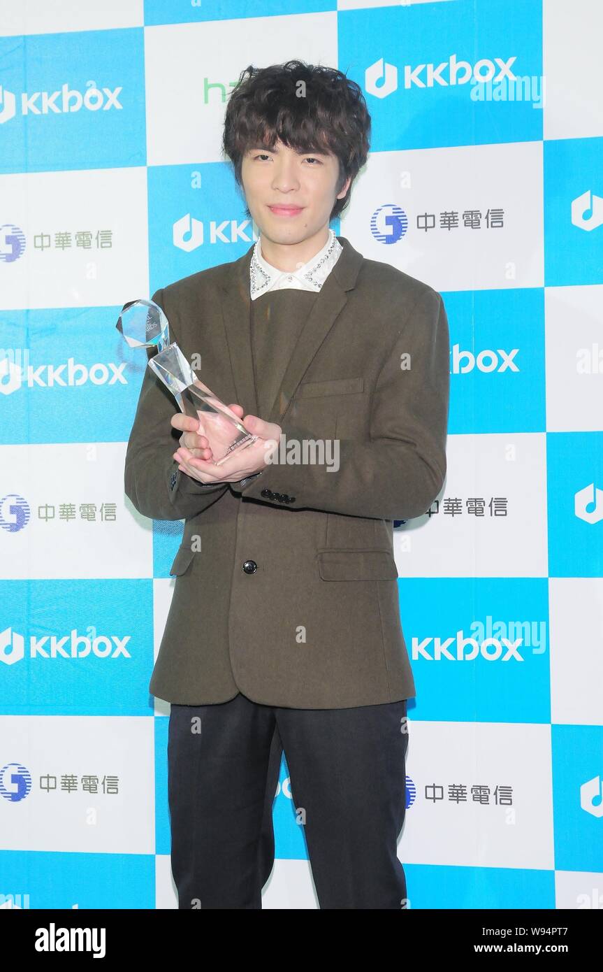 Taiwanese singer Jam Hsiao shows his trophy during the 8th KKBOX Music Awards ceremony in Taipei, 19 January 2013. Stock Photo