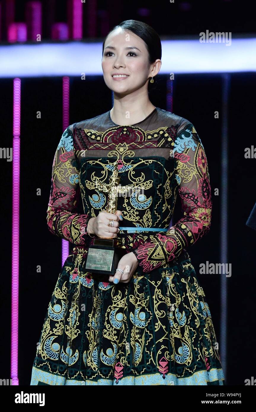 Chinese actress Zhang Ziyi smiles as she poses with her trophy for the ...