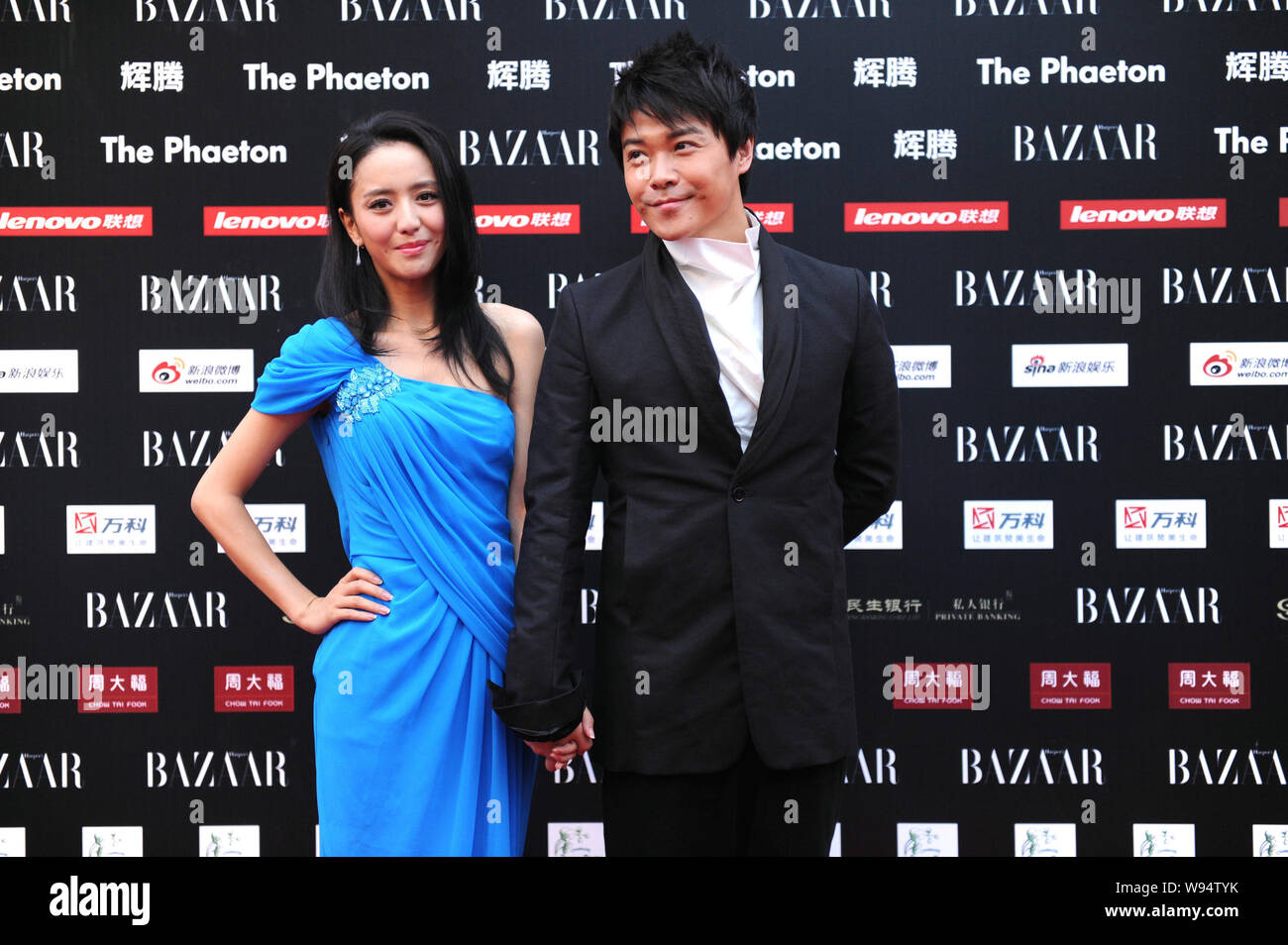 Chinese Actress Tong Liya Left And Actor Chen Sicheng Pose On The Red Carpet As They Arrive For The 2012 Bazaar Stars Charity Night In Beijing Chin Stock Photo Alamy