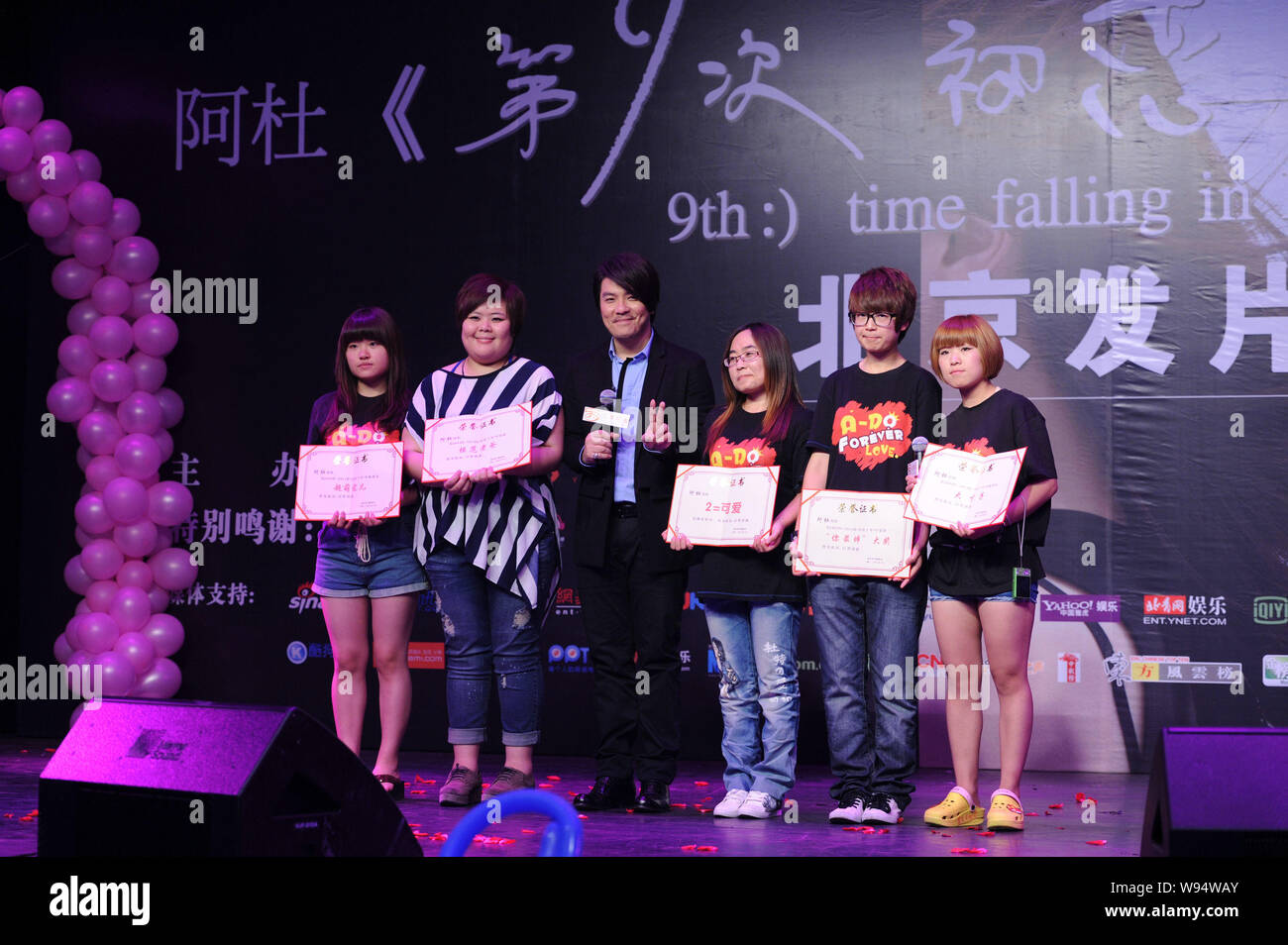 Singaporean singer Ado, third left, is pictured with fans during his  promotion of new album, 9th Time Falling in Love, in Beijing, China, 6 June  2012 Stock Photo - Alamy