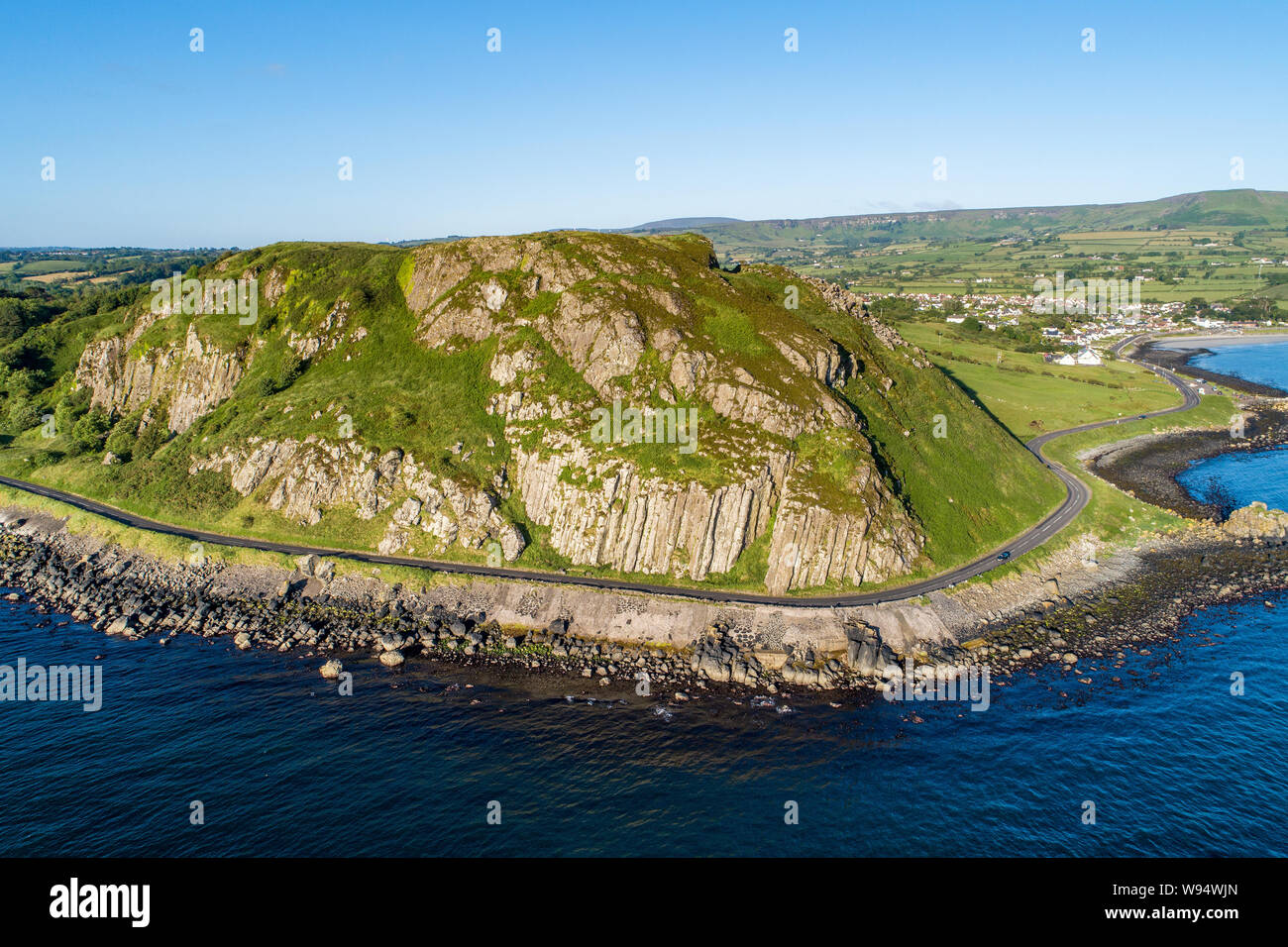 Northern Ireland, UK. Antrim Coast Road a.k.a Causeway Coastal Route near Ballygalley Head and resort. One of the most scenic coastal roads in Europe. Stock Photo
