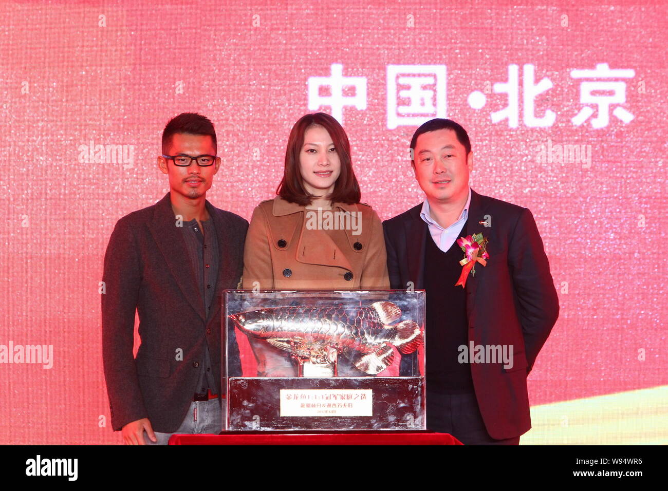 Chinese badminton Olympic-champion of Beijing and London Lin Dan (left),  his wife Xie Xingfang (center) pose at a promotional event in Beijing,  China Stock Photo - Alamy