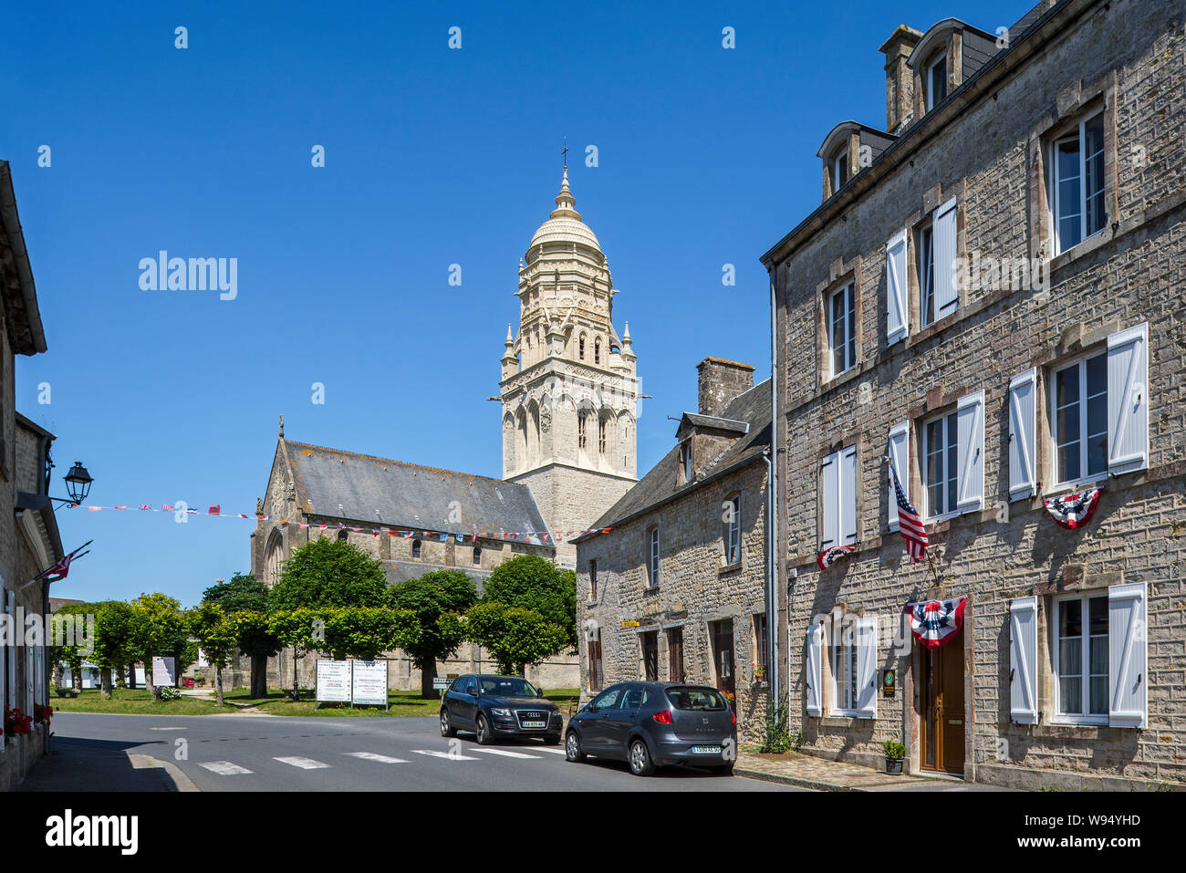 11th century church of Notre-Dame de l'Assomption in the village Sainte-Marie-du-Mont, Manche, Normandy, France Stock Photo