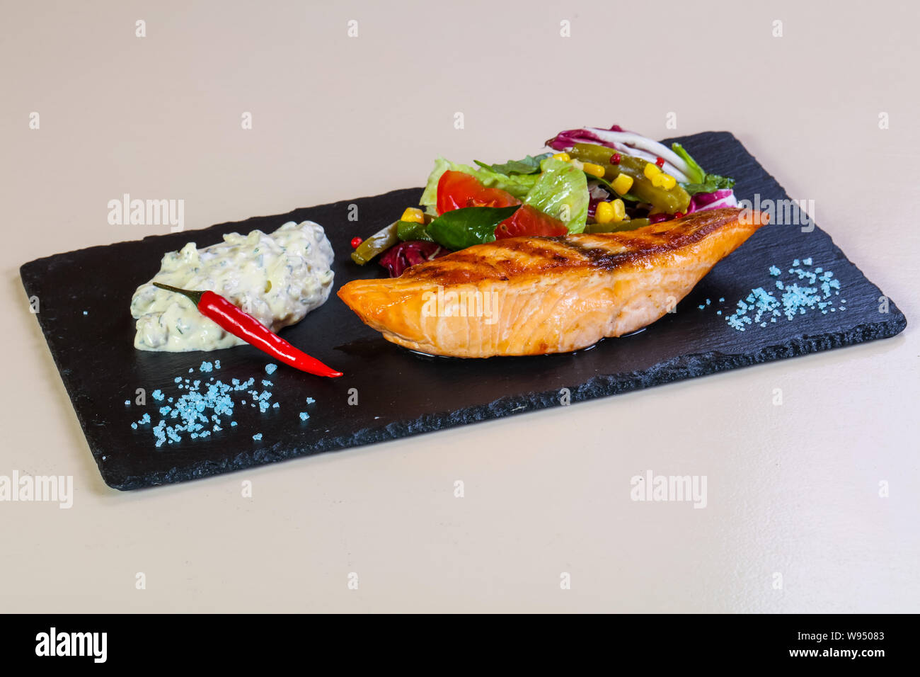 Grilled salmon steak with sauce Stock Photo - Alamy