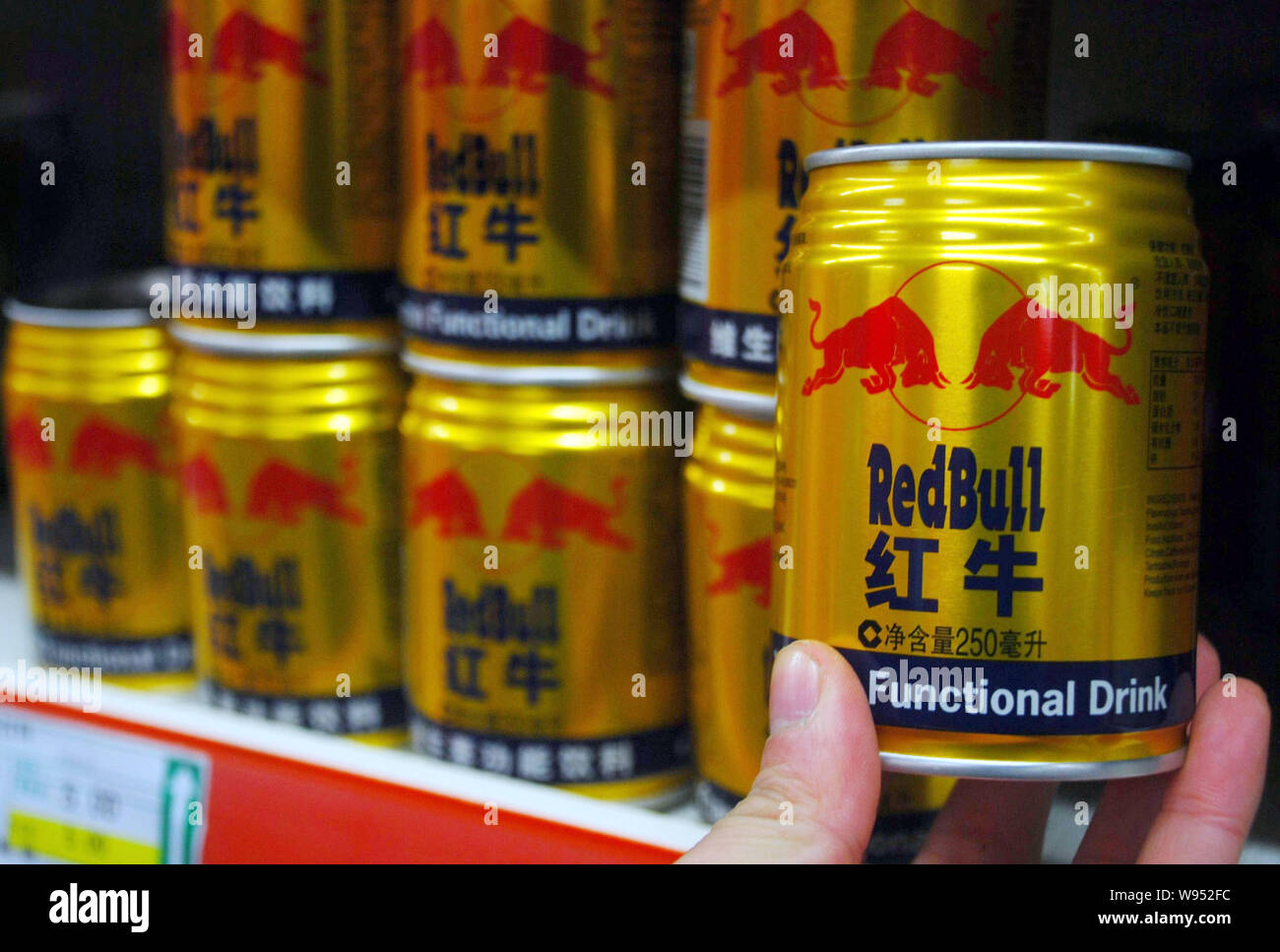 A Customer Buys A Can Of Red Bull Energy Drink At A Supermarket In Jiujiang City East Chinas Jiangxi Province 12 February 12 Supermarkets In So Stock Photo Alamy