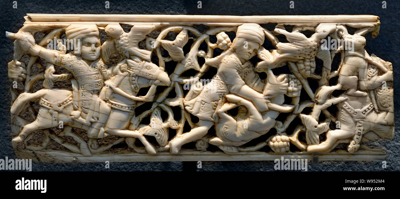 Decorative plaques Islamic Art Egypt, Le Claire, 11th century, They illustrate the princely pleasures, drinks, music, dance, hunting scene. (Ivory and openwork carving) Stock Photo