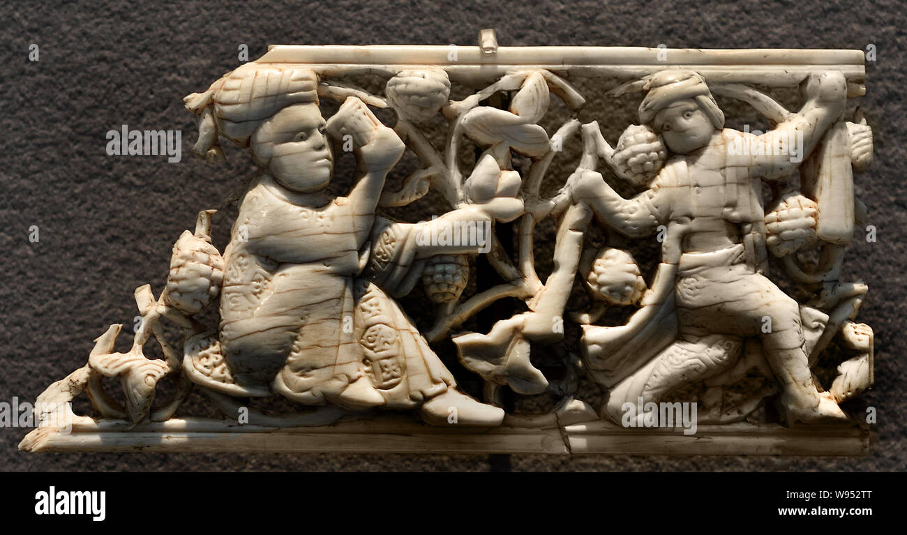 Decorative plaques Islamic Art Egypt, Le Claire, 11th century, They illustrate the princely pleasures, drinks, music, dance, hunting scene. (Ivory and openwork carving) Stock Photo
