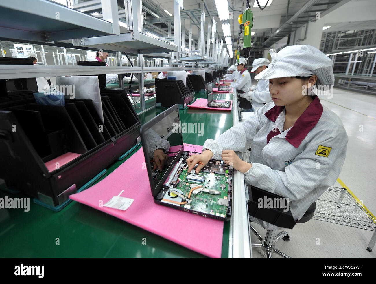 FILEChinese factory workers assemble laptop computers at the plant