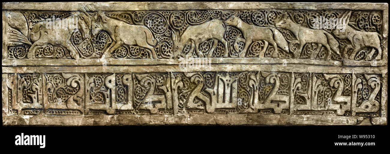 Frize with Koranic inscription 1000-1100 Iran, Saveh.   The stucco was discovered in Saveh in 1929, it is unclear what monument they come from. They belonged to a larger wall decoration that originally had an entire Koranic verse whose only beginning and end are visible here. The calligraphy is similar to that of monuments of Saveh and Nayin. Stock Photo