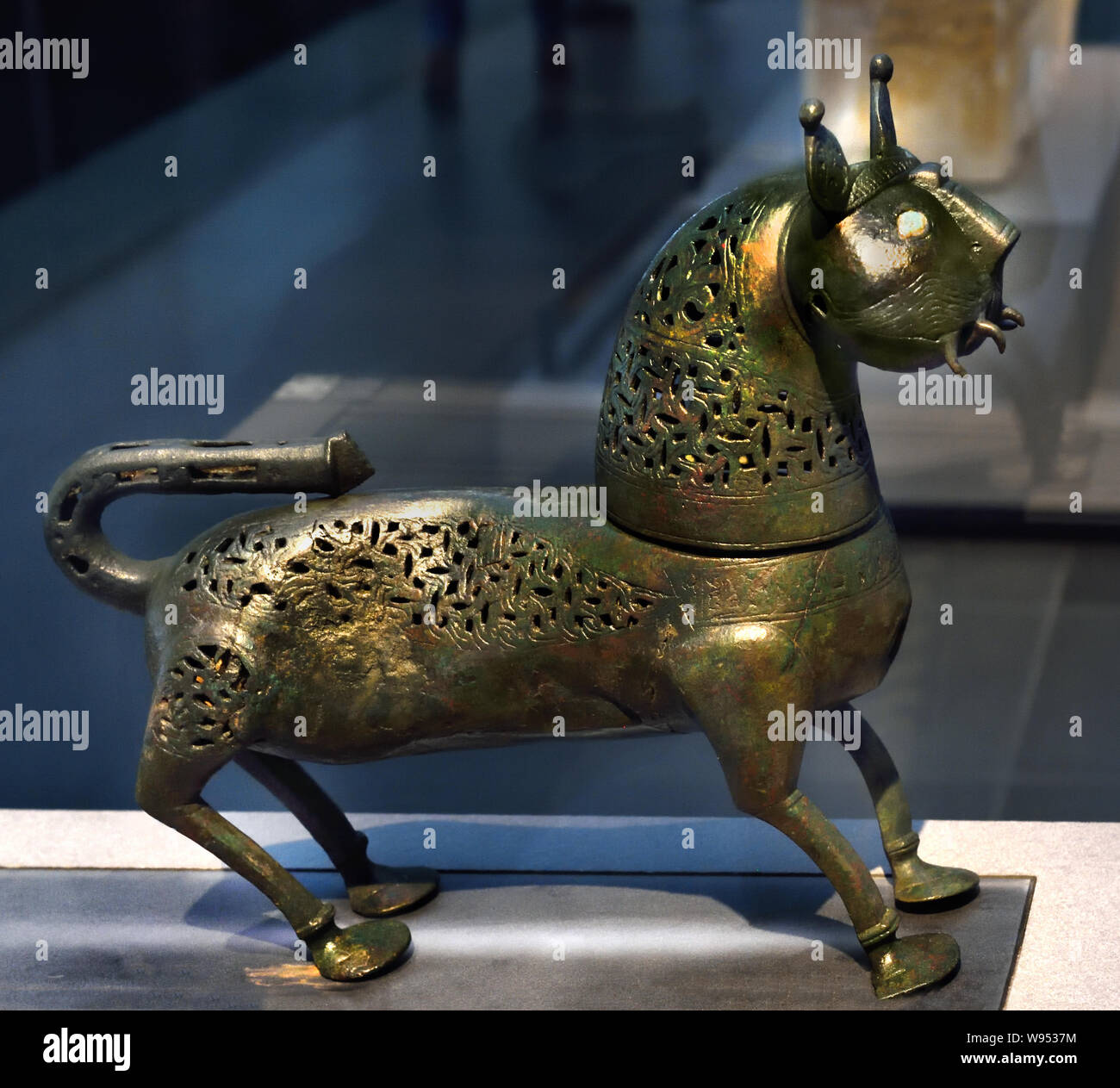 Feline burns-perfume 11th century Khorasan or Central Asia Cast copper, openwork decoration, engraved, inlaid with glass ( Khorasan, is a historical region lying northeast of Greater Iran, including northeastern Iran, much of Central Asia and Afghanistan.) Stock Photo