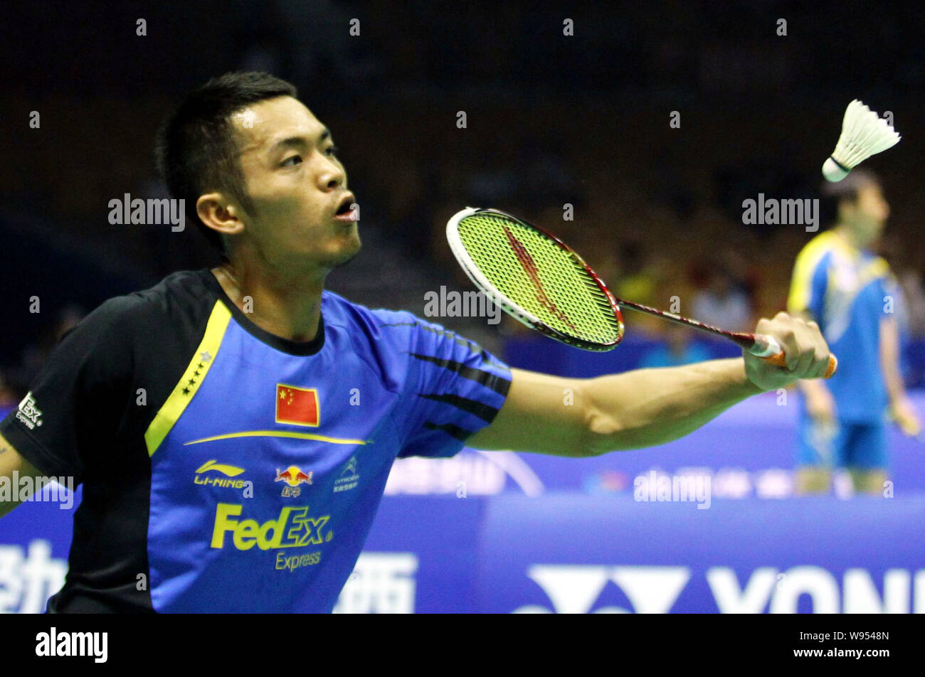 Chinas Lin Dan returns a shot against Daren Liew of Malaysia in their quarterfinal match during the Thomas Cup world badminton team championships in W Stock Photo