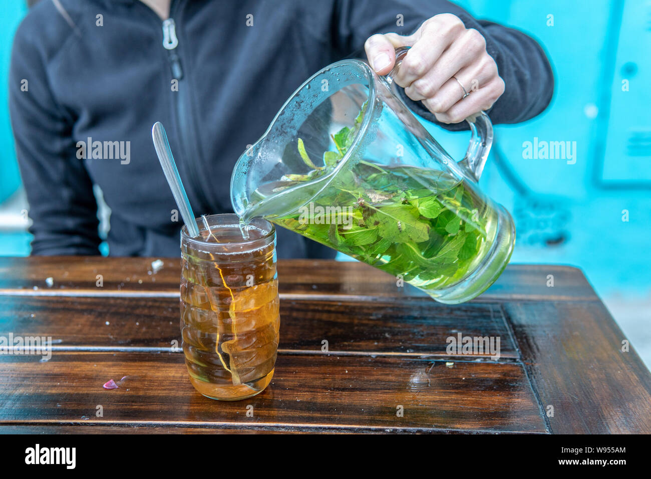 Pouring hot mind tea over a tea bag Stock Photo - Alamy