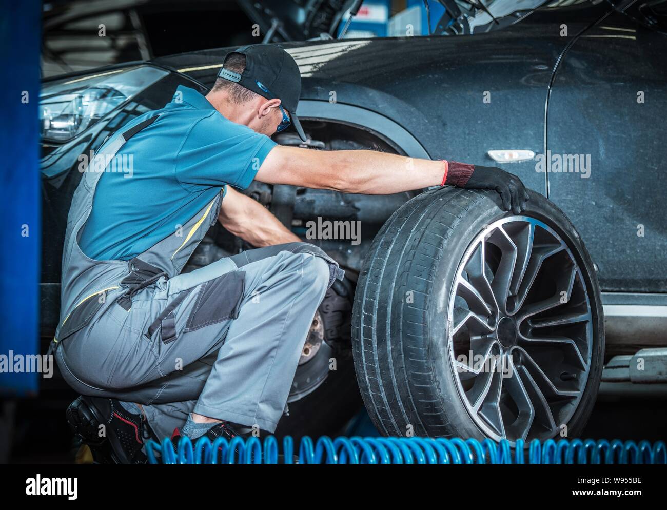 Modern Car Brakes Check by Professional Vehicle Mechanic. Dealership