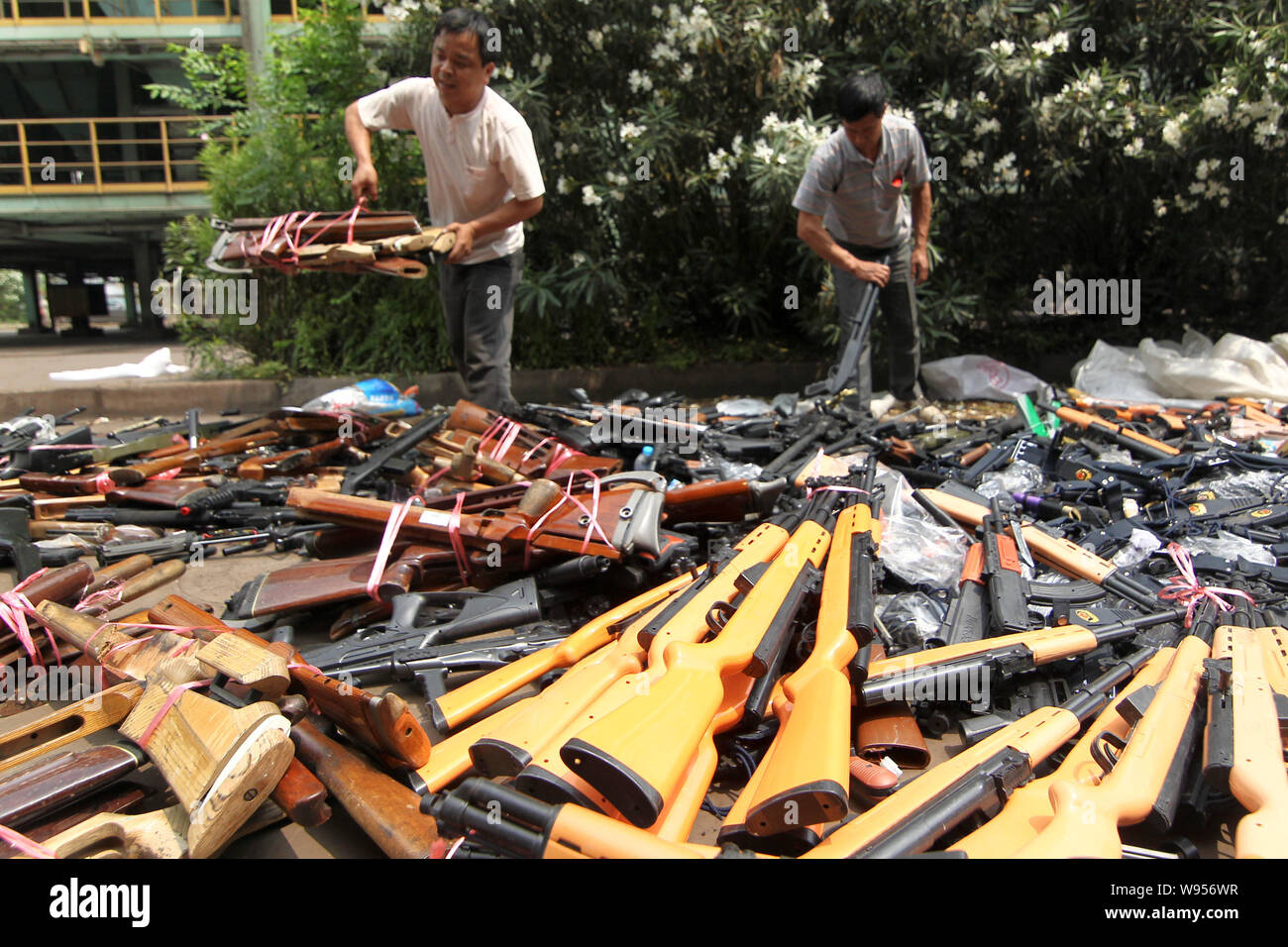 Siezed illegal weapons are seen being destroyed in Shanghai, China, 12