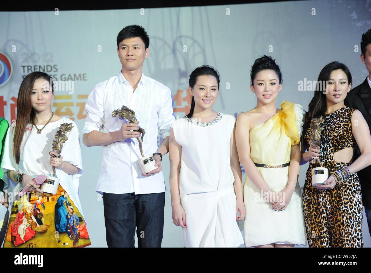 Stars (from left), singer Zhang Liangyin, Olympic fencing gold medalist Zhong Man, Olympic gymnastic gold medalist Liu Xuan, billard player Pan Xiaoti Stock Photo