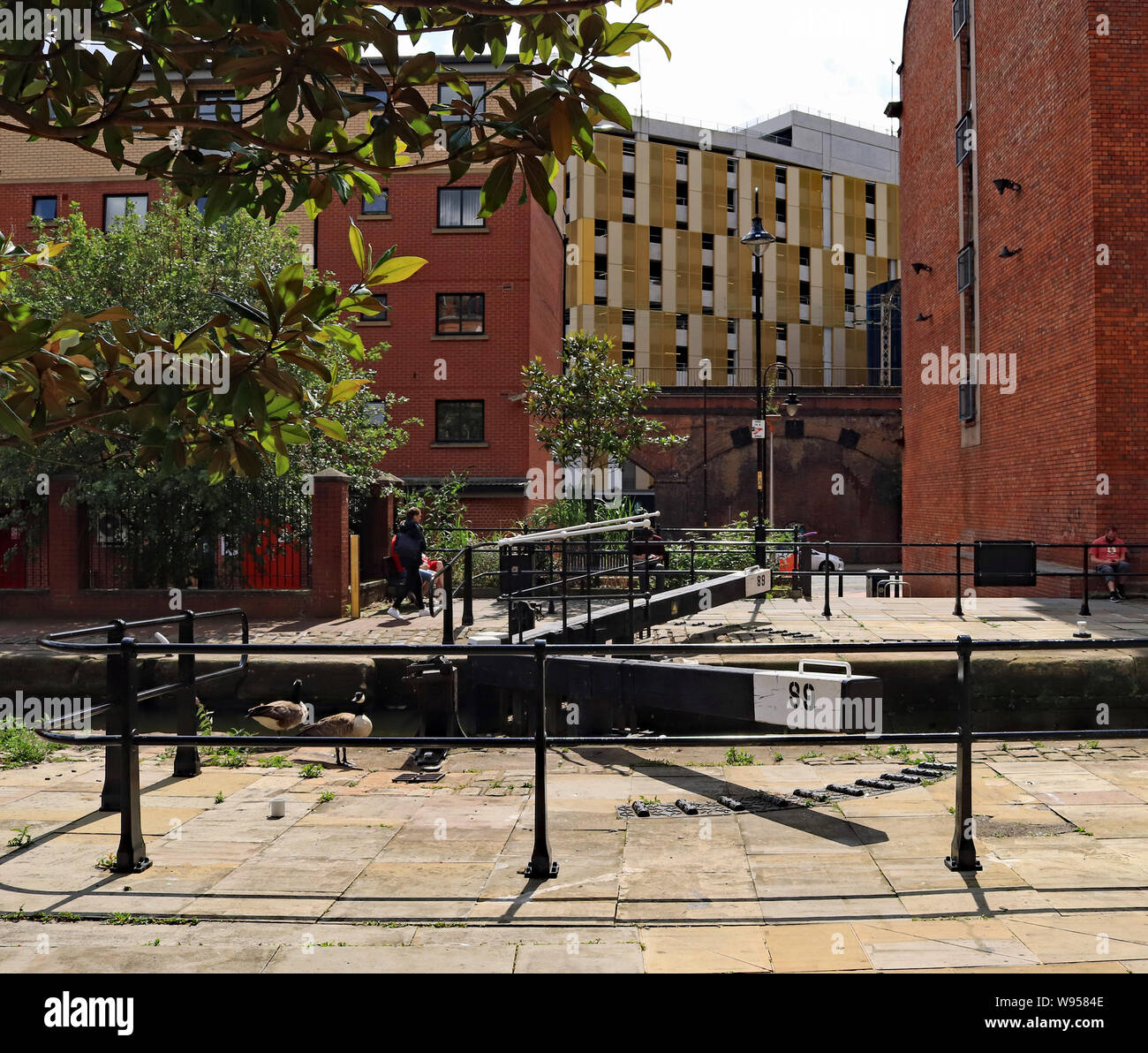 Safety fencing recently installed to deter people from crossing the lock gates on Tib Lock on The Rochdale canal in central Manchester. Stock Photo