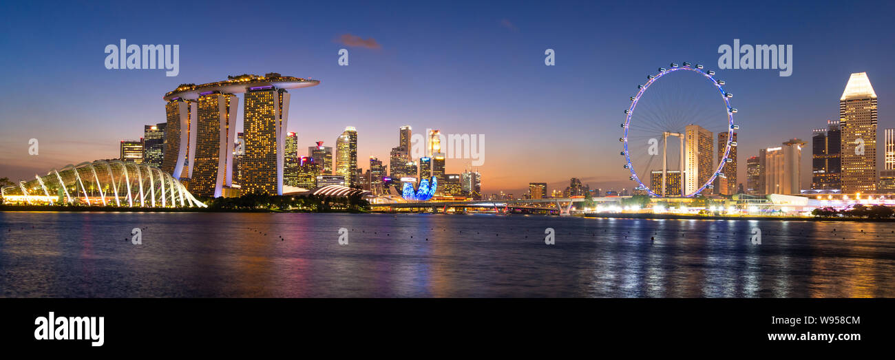 Panorama view of business downtown building area during twilight time at Singapore. Stock Photo