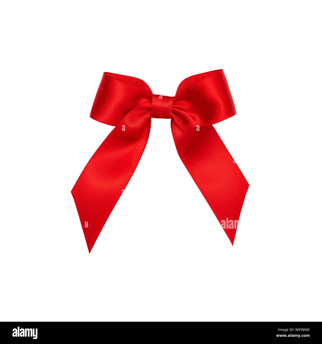 Red bow cut out and isolated on white background Stock Photo