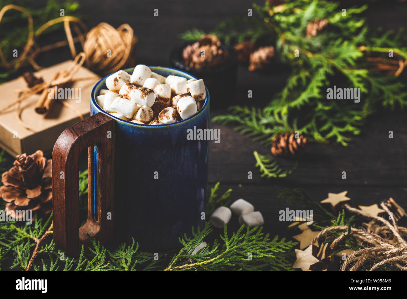 Christmas composition on dark background. Christmas cocoa cup on christmas decoration. Stock Photo