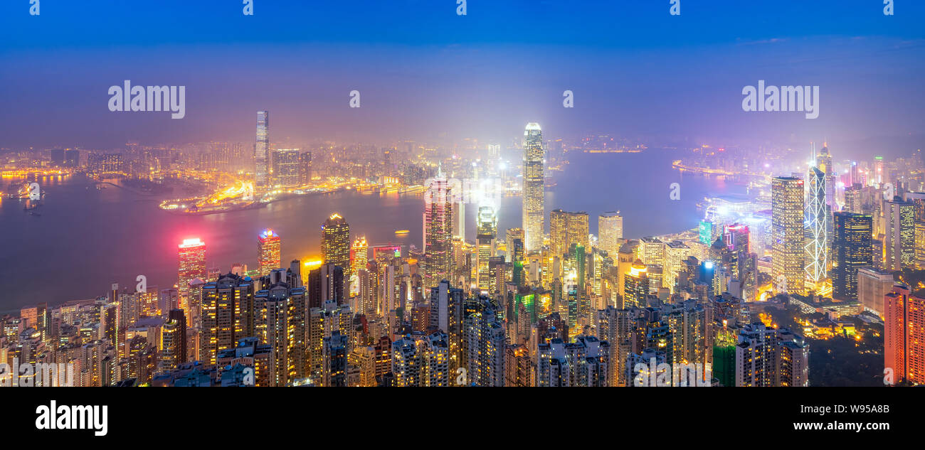 Panorama view over Hong kong downtown the famous cityscape view of Hong Kong skyline during twilight time view from the Victoria peak in Hong Kong. Stock Photo