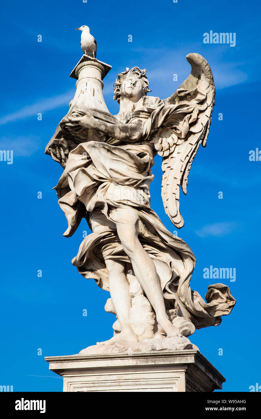 Beautiful Angel with the Column statue created by Antonio Raggi on the 16th century at Sant Angelo Bridge in Rome Stock Photo