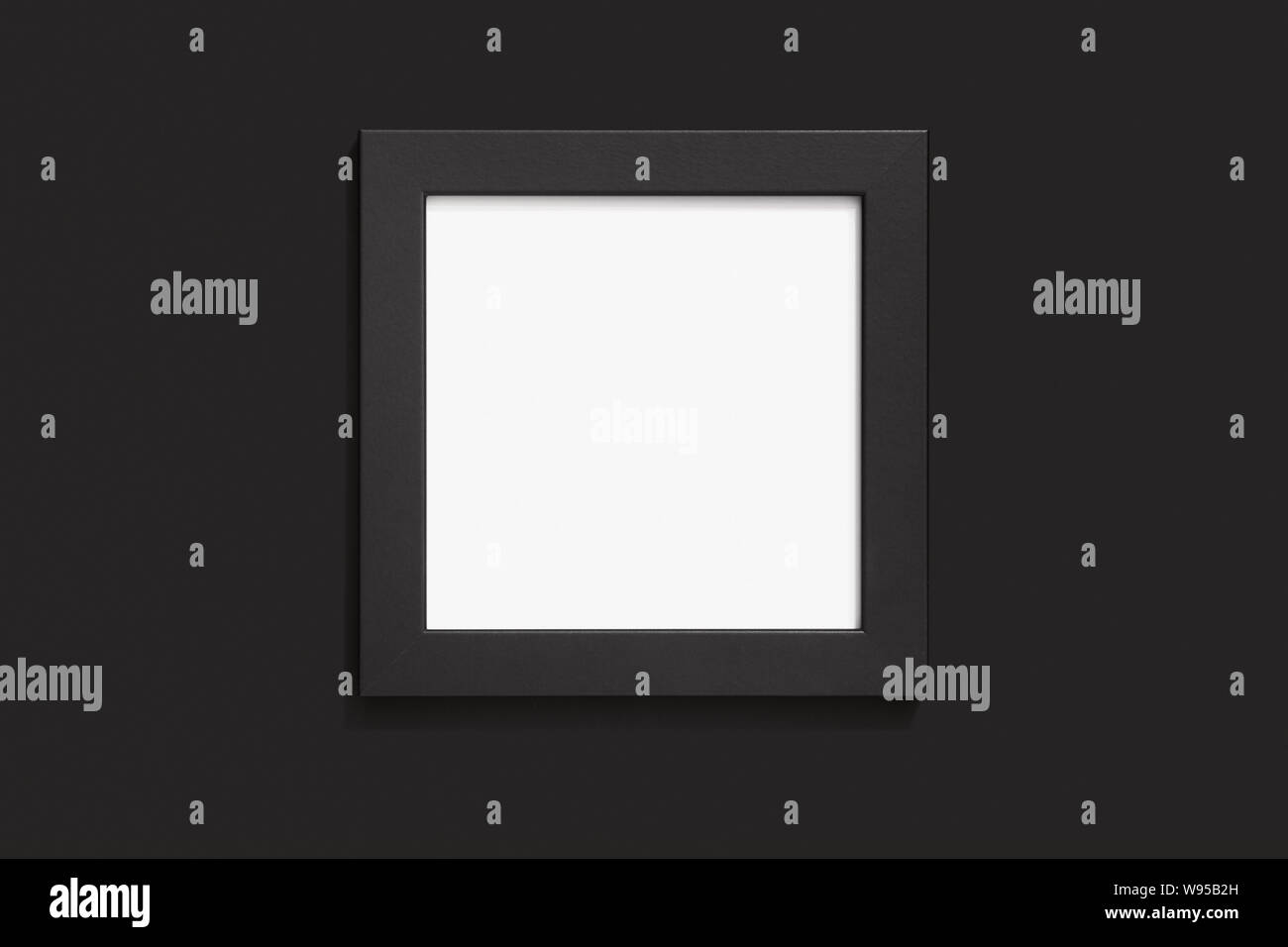 Blank black frame mock up on black background, empty picture template flat lay Stock Photo