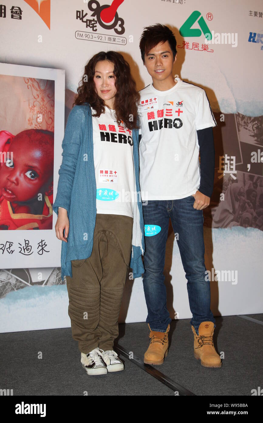 Hong Kong singers Ivana Wong and Hins Cheung pose during a charity