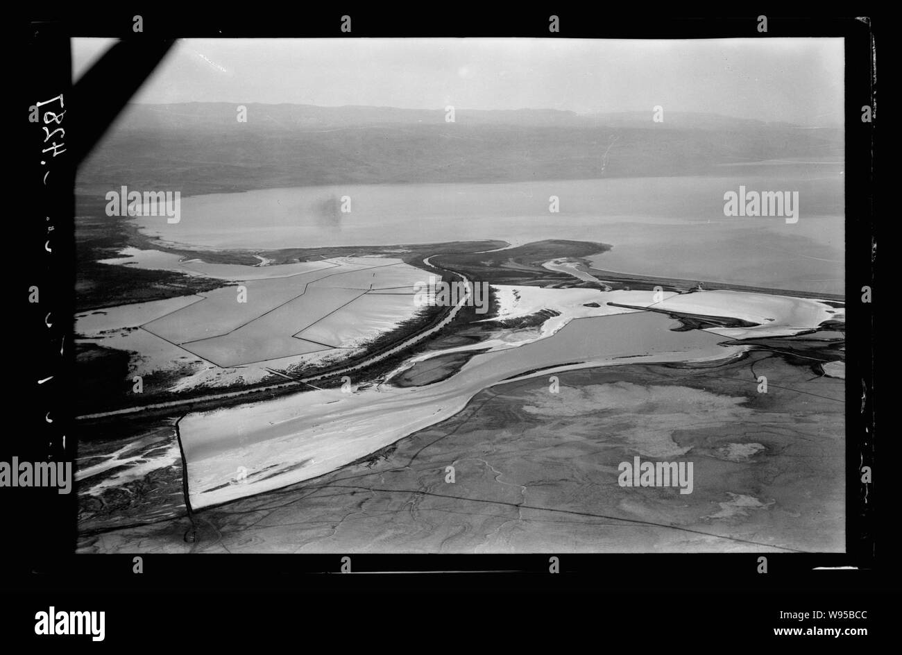 Air views of Palestine. North end of Dead Sea. Jordan entering the Dead Sea. Looking S. showing mts. of Moab in distance Stock Photo