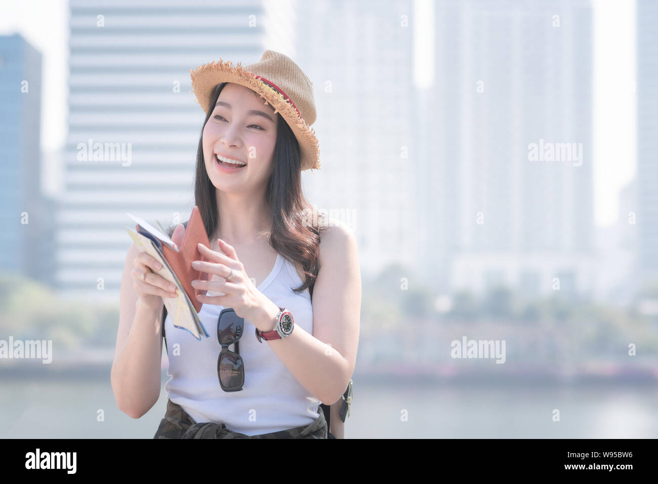 Beautiful asian  tourist woman smiling and enjoying the vacation travel in summer. Stock Photo
