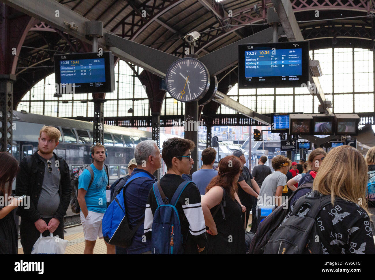 European rail travel and Interrail - railway station platform crowded with rail passengers at Copenhagen Central Station, Copenhagen Denmark Europe Stock Photo