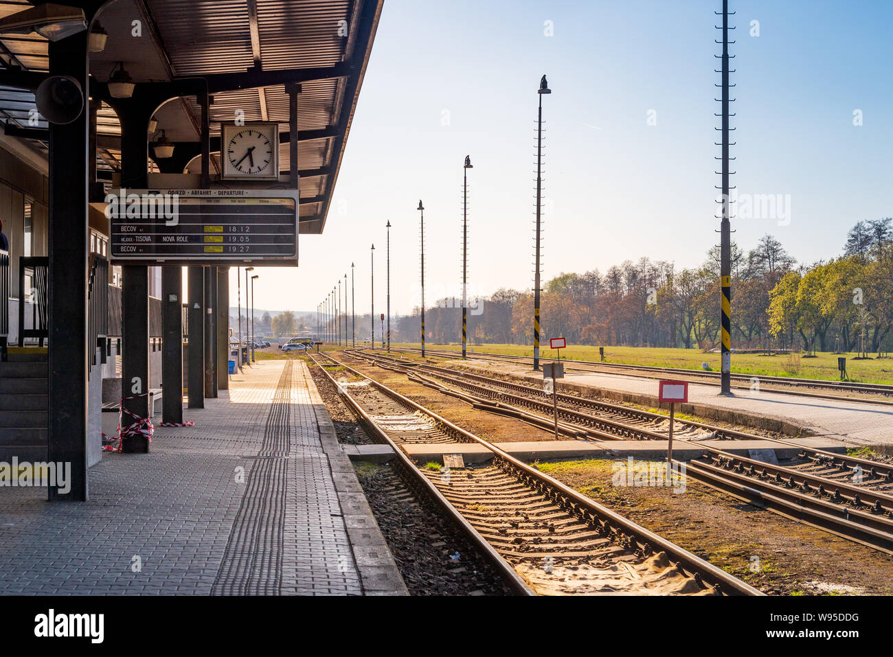 View on platform of train station without people in Karlovy vary, Czech  Republic. Mood of sole travel, journey or travel alone by train in Europe  Stock Photo - Alamy