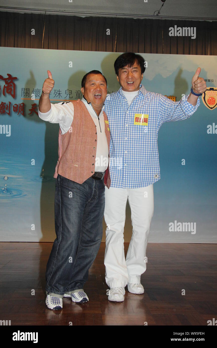 Hong Kong kungfu superstar Jackie Chan, right, poses with actor Eric Tsang at the launch ceremony for the Donation Campaign for the Po Leung Kuk Speci Stock Photo