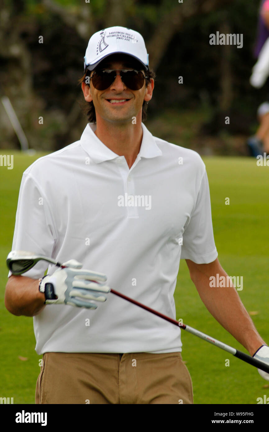 US actor and film producer Adrien Brody looks on during the 2012 Mission Hills World Celebrity Pro-Am golf tournament in Haikou city, south Chinas Hai Stock Photo